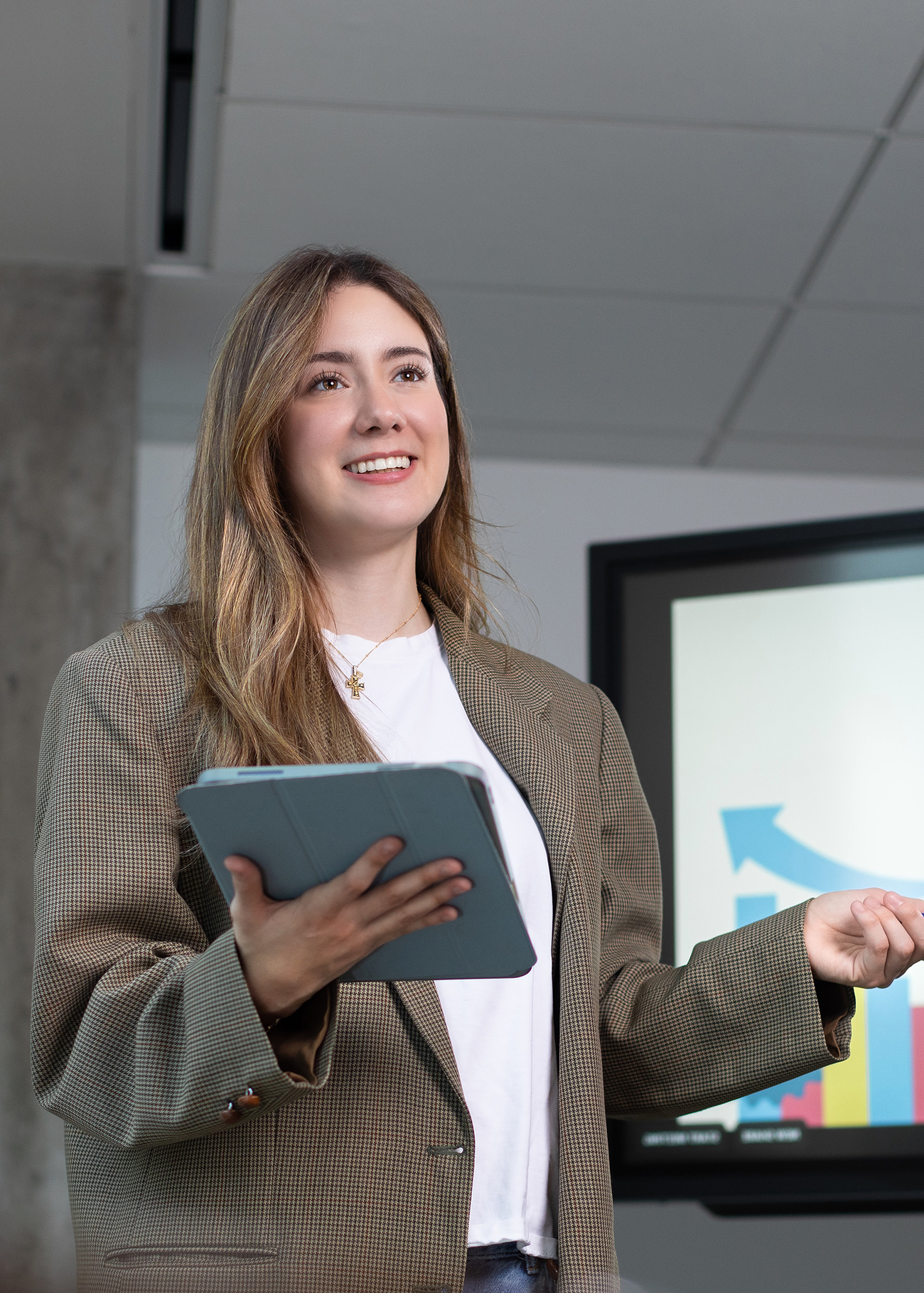 Student Isabella Chavez standing and talking in a classroom.